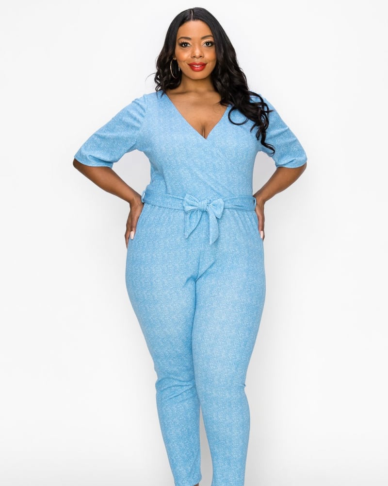 Front of a model wearing a plus size Wrap Denim Jumpsuit in Light Blue by L I V D. | dia_product_style_image_id:240149